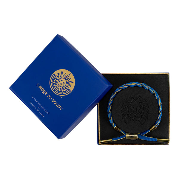 Bracelet tressé Rastaclat du Cirque du Soleil en bleu - en vue de la boîte